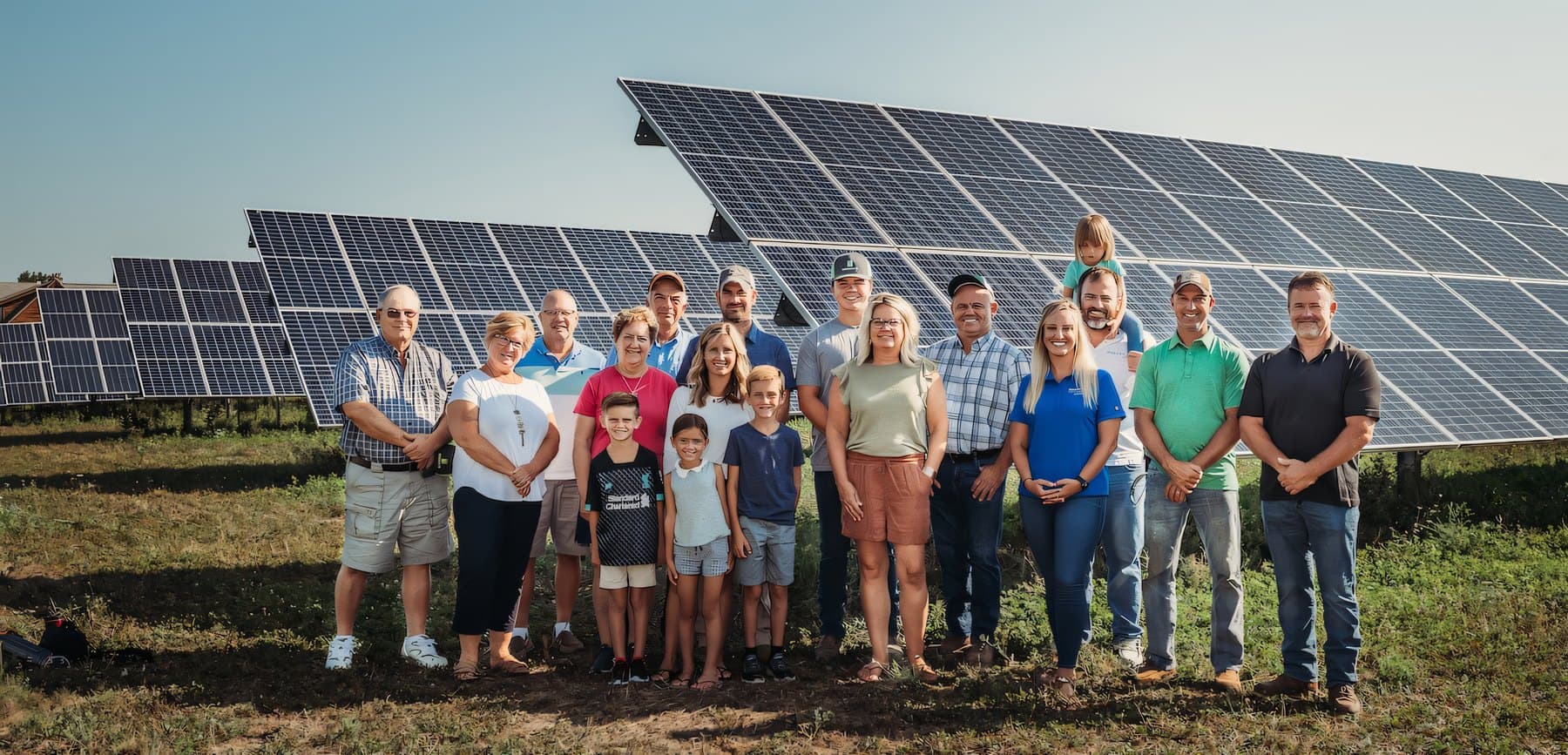 The AEG team in front of one of our community solar partner farms